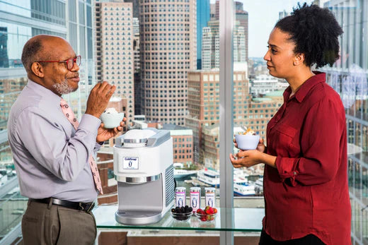 Two office employees enjoying ColdSnap frozen treats over a break
