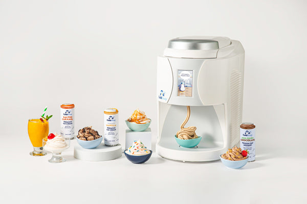 ColdSnap® Frozen Treat Machine, surrounded by various treat pods and ice cream bowls