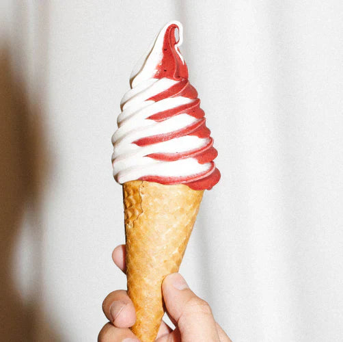 A cond of Strawberry Vanilla swirl soft serve ice cream