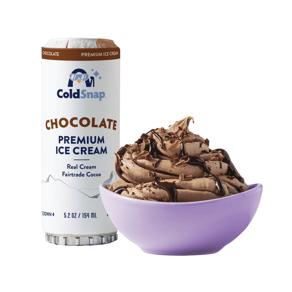 ColdSnap® Chocolate Premium Ice Cream pod next to a prepared bowl of chocolate ice cream drizzled with chocolate sauce and topped with shaved chocolate