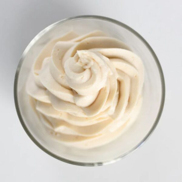 Creamy white ColdSnap Ice cream in a glass bowl on a light gray background