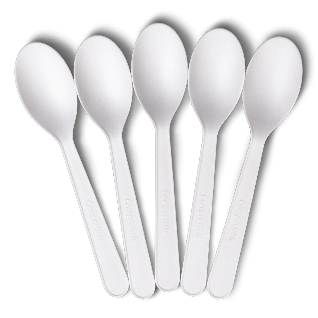 A set of five white spoons