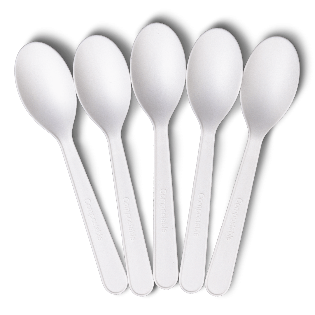 A set of five white spoons