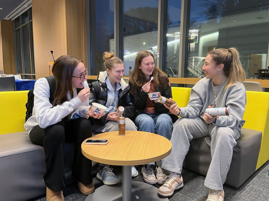 Four female students enjoying ColdSnap® treats in a university lounge