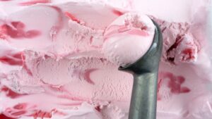 scooping strawberry ice cream 